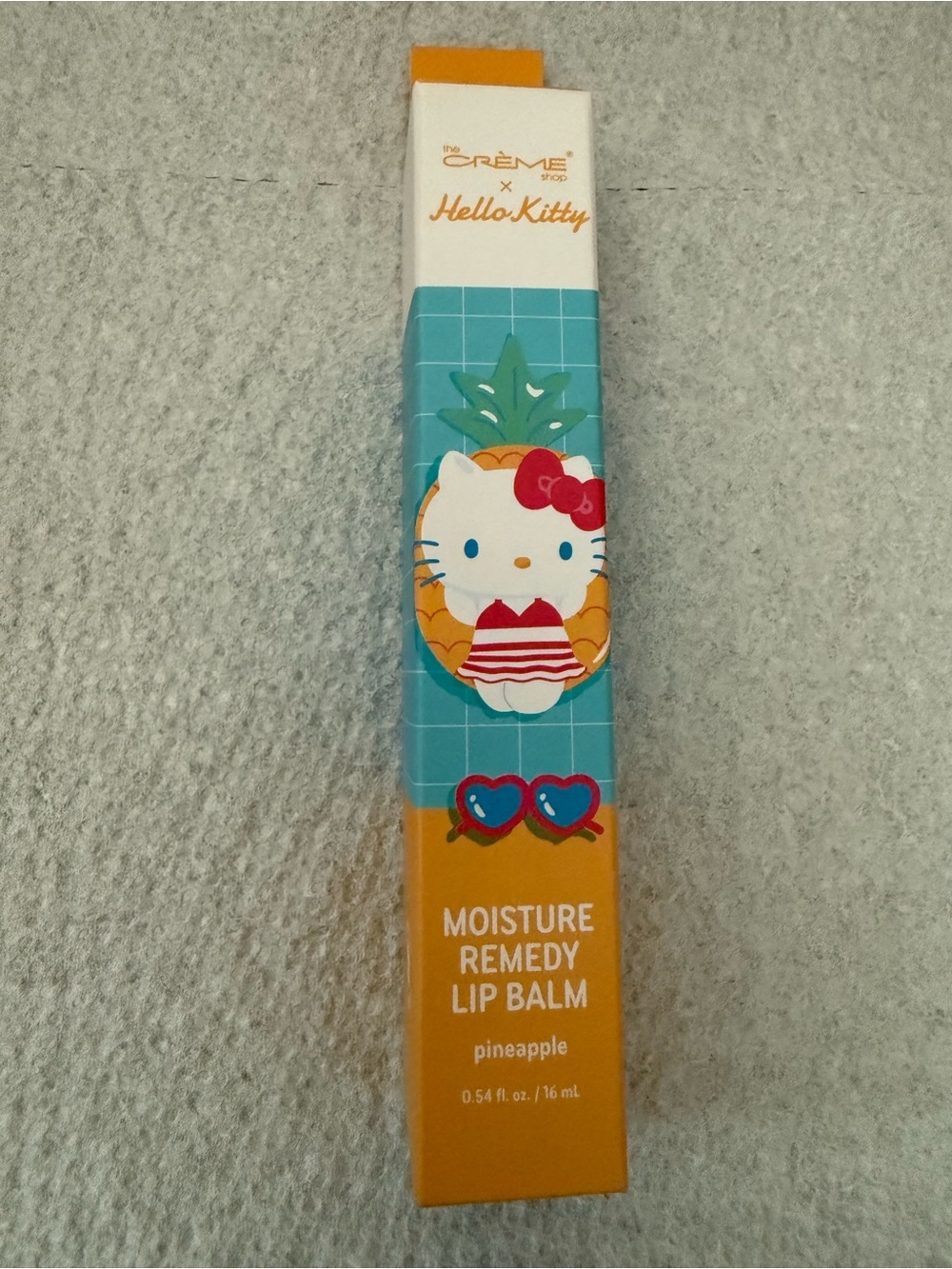 The Crème Shop x Hello Kitty Moisture Remedy Lip Balm NIP- PINEAPPLE